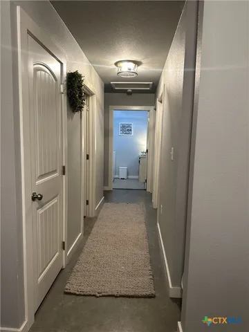 a kitchen with stainless steel appliances granite countertop a sink a stove and cabinets