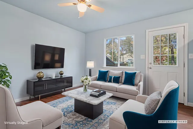 a living room with furniture and a flat screen tv