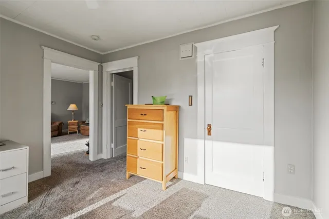 a view of room with closet and mirror