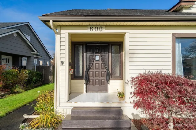 a front view of a house with a garden