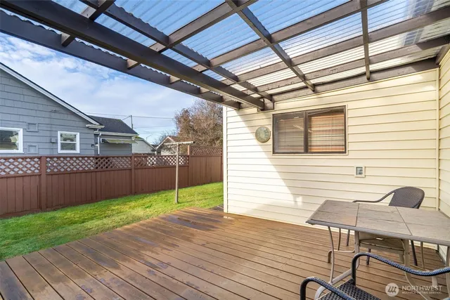 a view of a porch with wooden floor