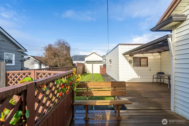 a view of a house with wooden deck