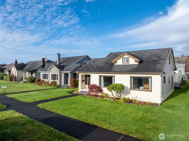 a front view of a house with garden
