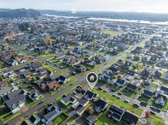 an aerial view of residential houses with outdoor space