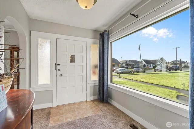 a view of an empty room and window