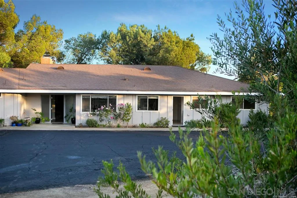 29760 Miller Road Valley Center, CA 92082 - Photo 4 of 25 a house view with a garden space