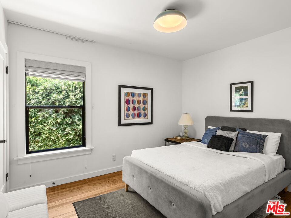 4707 Toland Way Los Angeles, CA 90042 - Photo 12 of 31 a bedroom with bed and window