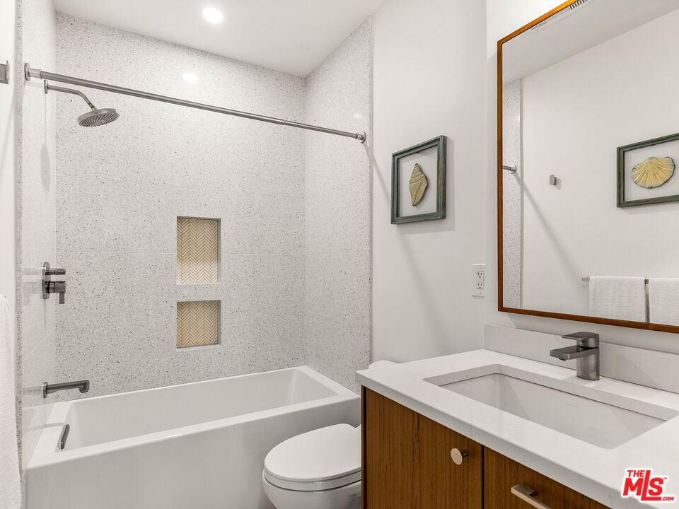 4707 Toland Way Los Angeles, CA 90042 - Photo 14 of 31 a bathroom with a granite countertop sink toilet and shower