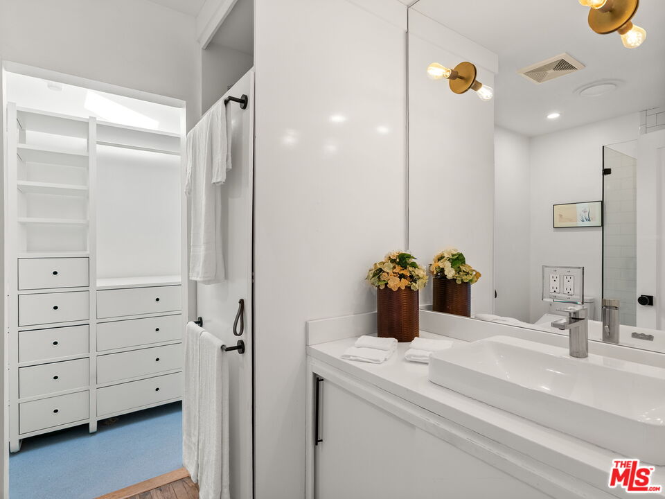 4707 Toland Way Los Angeles, CA 90042 - Photo 17 of 31 a bathroom with a sink and a mirror