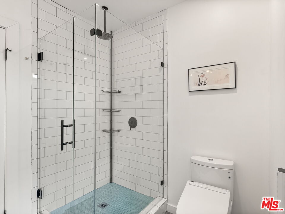 4707 Toland Way Los Angeles, CA 90042 - Photo 18 of 31 a bathroom with a shower and toilet