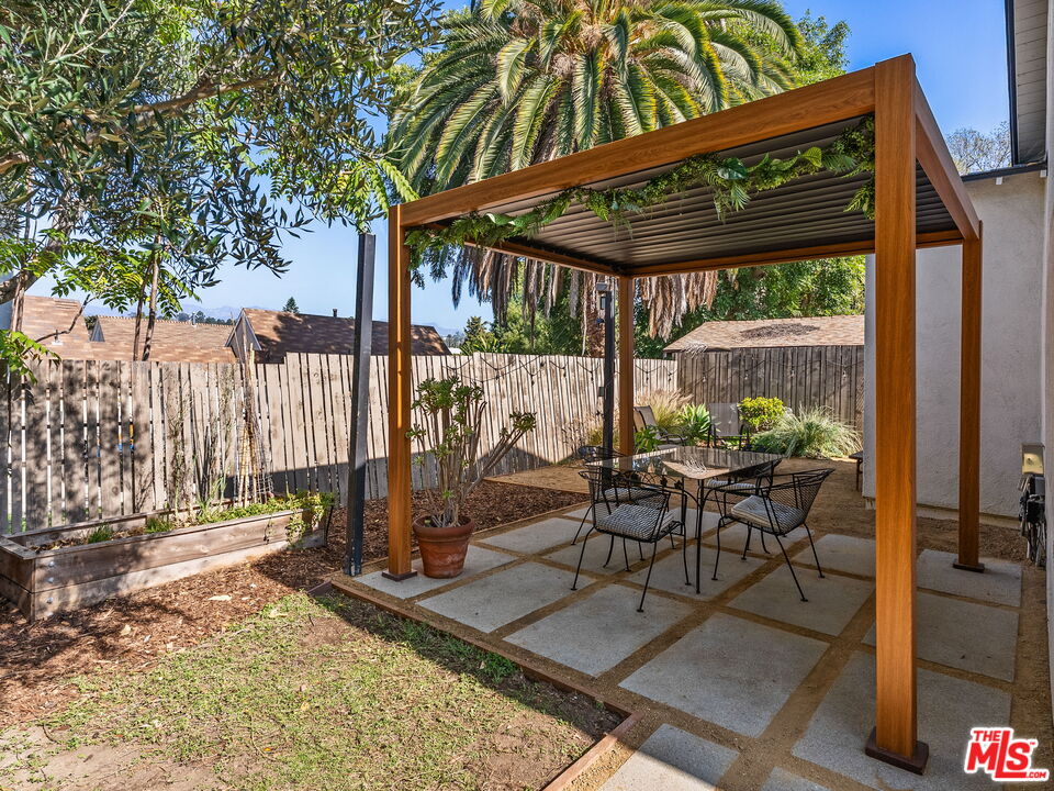 4707 Toland Way Los Angeles, CA 90042 - Photo 23 of 31 a patio with glass top table and chairs