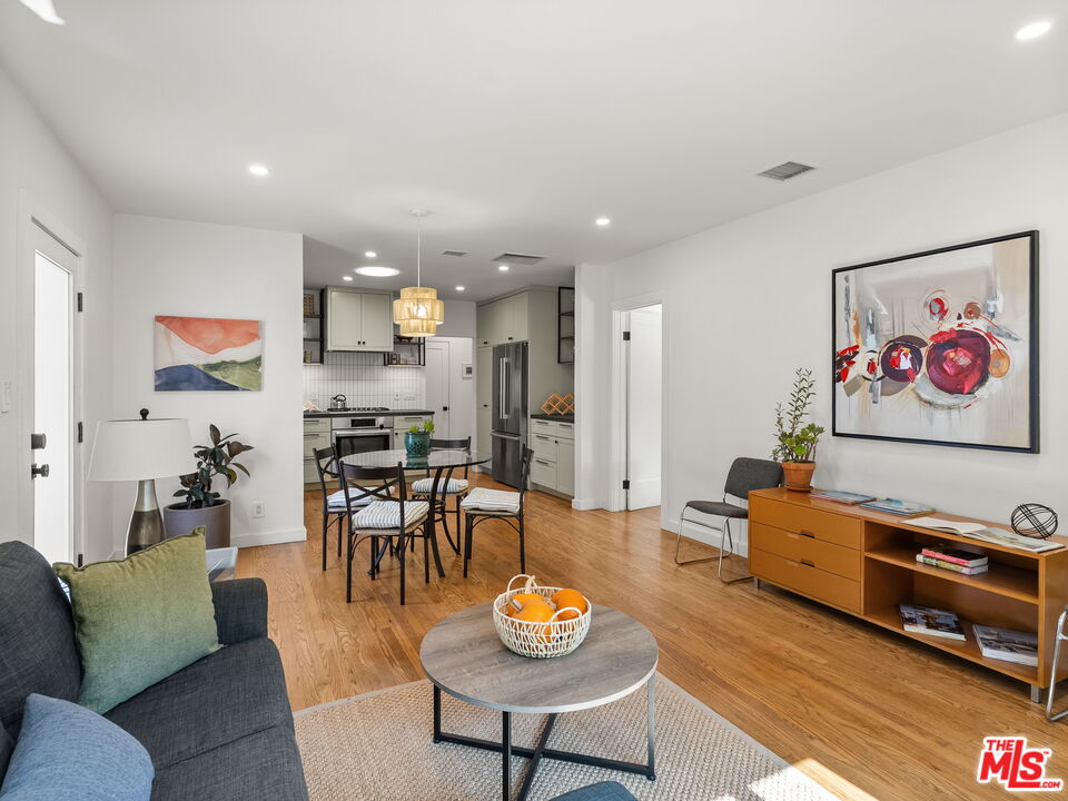 4707 Toland Way Los Angeles, CA 90042 - Photo 6 of 31 a living room with furniture kitchen view and a table