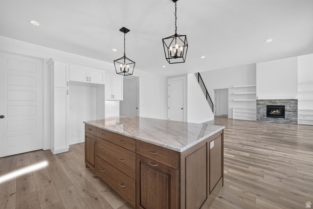 1002 West Temple Rim Lane Payson, UT 84651 - Photo 20 of 68 Kitchen island with a light-toned countertop and wood-finish cabinetry