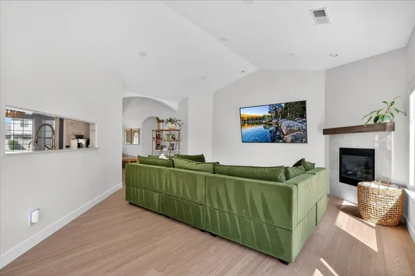 a living room with furniture and a fireplace