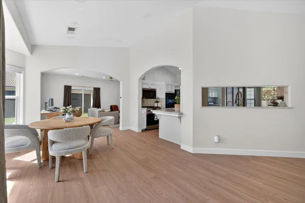 a living room with furniture and a baby crib