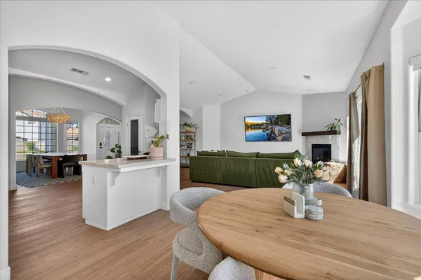 a spacious bedroom with a bed and a flat screen tv