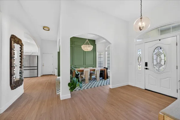 a living room with furniture a window and a table