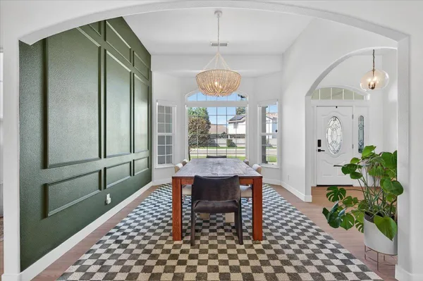 a living room with furniture window and a wooden floor