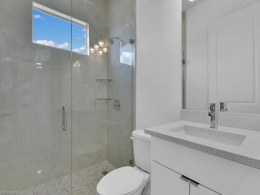 6108 Stratton Road Fort Myers, FL 33905 - Photo 21 of 27 Bathroom featuring vanity and a shower stall
