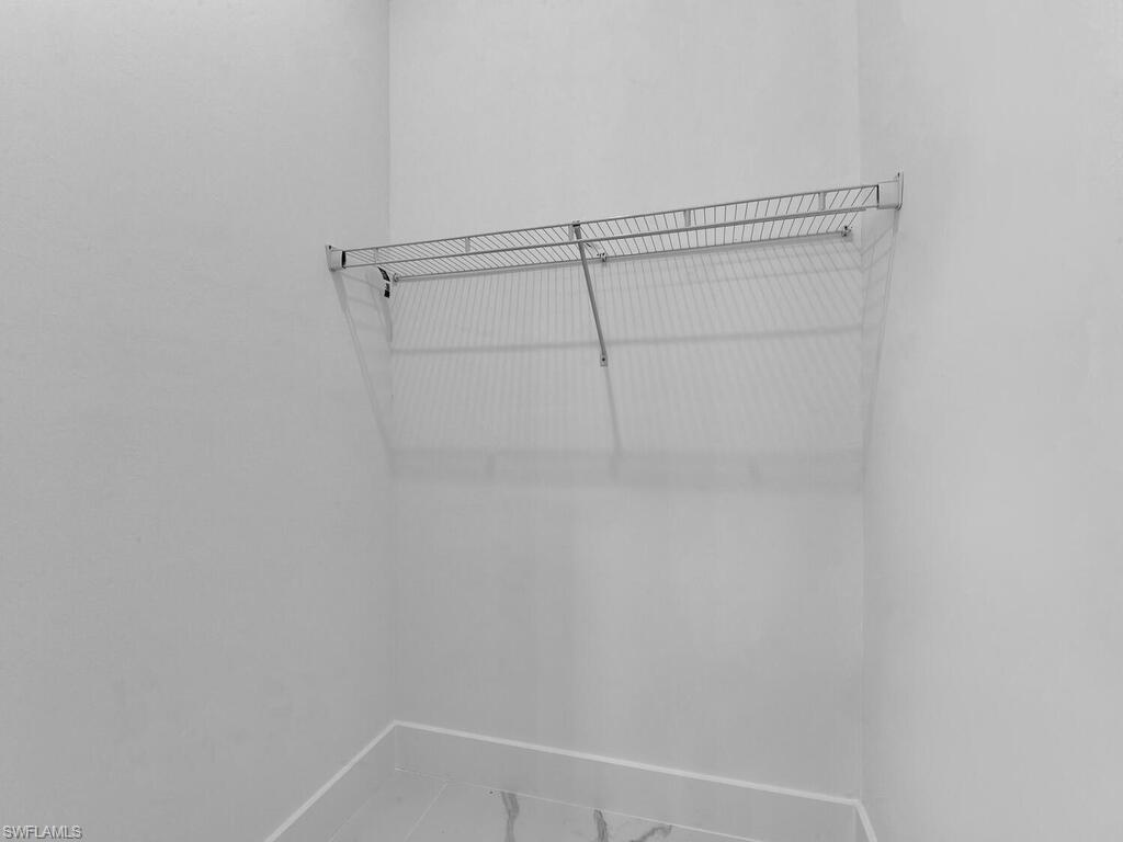 6108 Stratton Road Fort Myers, FL 33905 - Photo 24 of 27 Spacious closet with marble look tile flooring