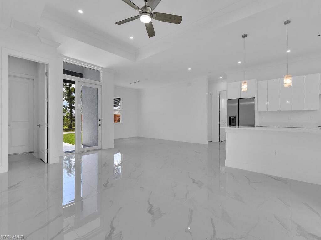 6108 Stratton Road Fort Myers, FL 33905 - Photo 5 of 27 Unfurnished living room with recessed lighting, a ceiling fan, and light marble finish flooring