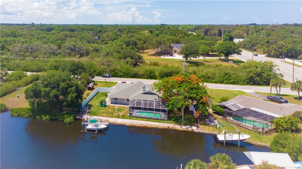 1507 Robbins Road Nokomis, FL 34275 - Photo 1 of 1 an aerial view of residential house with outdoor space and swimming pool