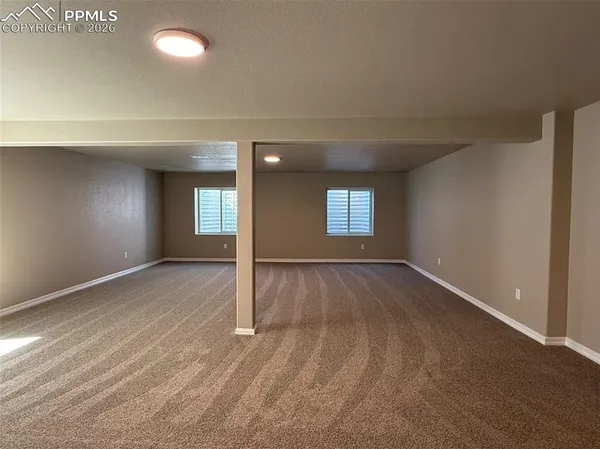 a view of an empty room and window