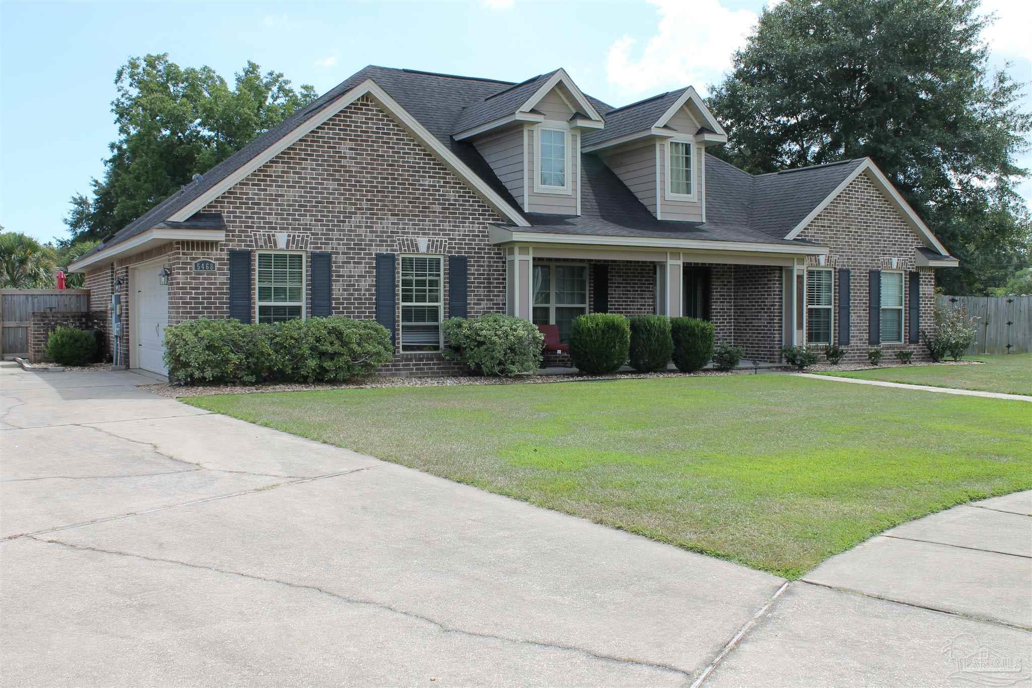 5468 Madelines Way Pace, FL 32571 - Photo 2 of 45 a front view of a house with a yard