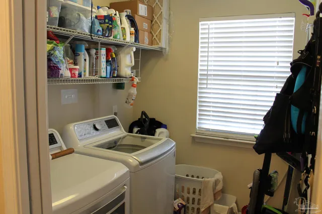 a utility room with dryer and washer