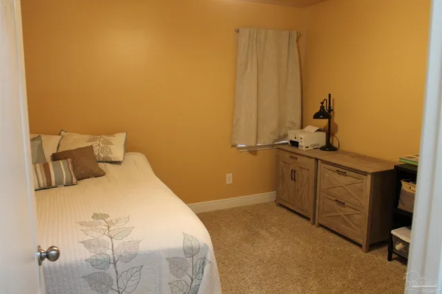 a bedroom with a bed and a cabinets