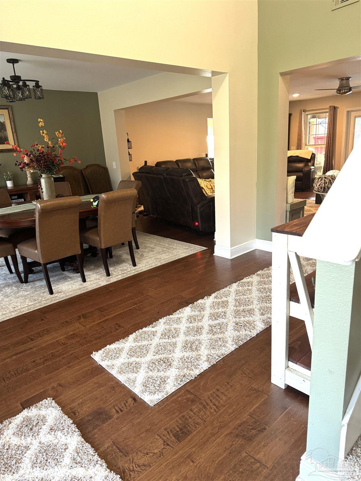 5468 Madelines Way Pace, FL 32571 - Photo 43 of 45 a living room with furniture and wooden floor