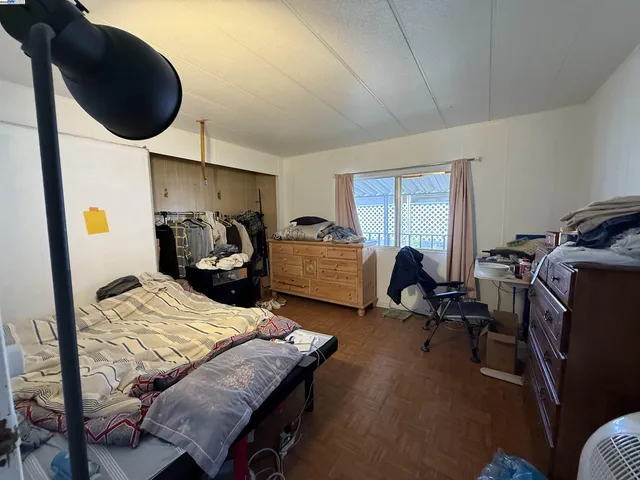 a bed room with furniture and a window