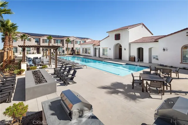 a living room with lots of furniture and a flat screen tv