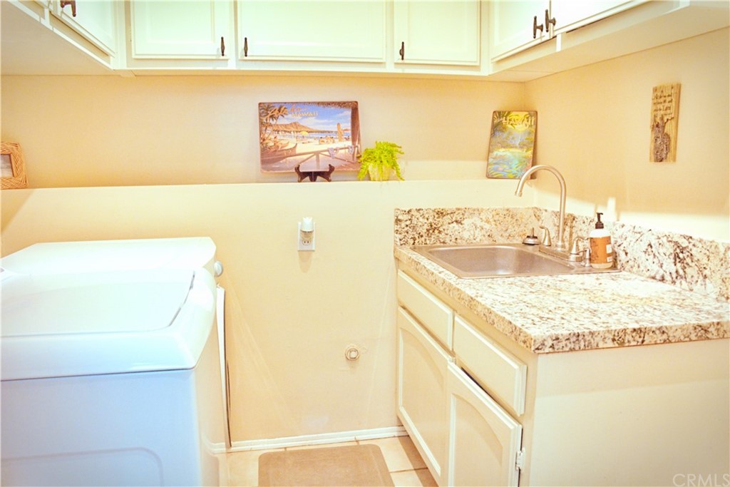 6038 KOA Drive Rialto, CA 92377 - Photo 13 of 18 a bathroom with a sink and a mirror