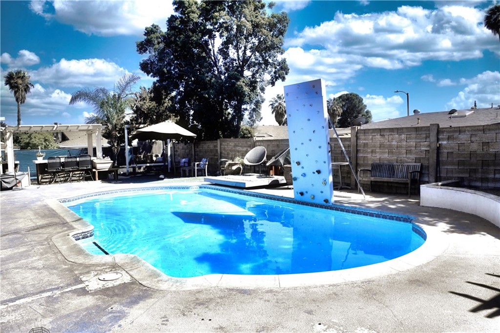 6038 KOA Drive Rialto, CA 92377 - Photo 15 of 18 a view of a swimming pool with outdoor seating