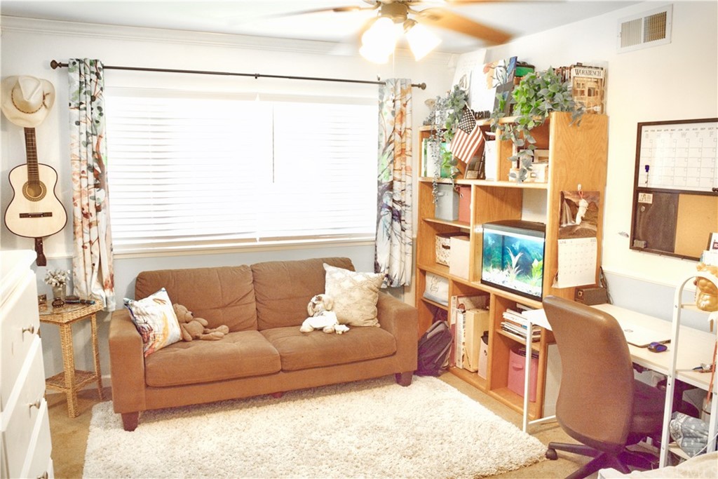 6038 KOA Drive Rialto, CA 92377 - Photo 10 of 18 a living room with furniture and a window