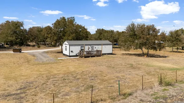 a view of a house with basketball court
