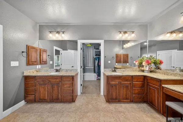 a living room with furniture and a ceiling fan