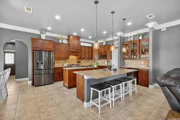 a living room with furniture and flowers