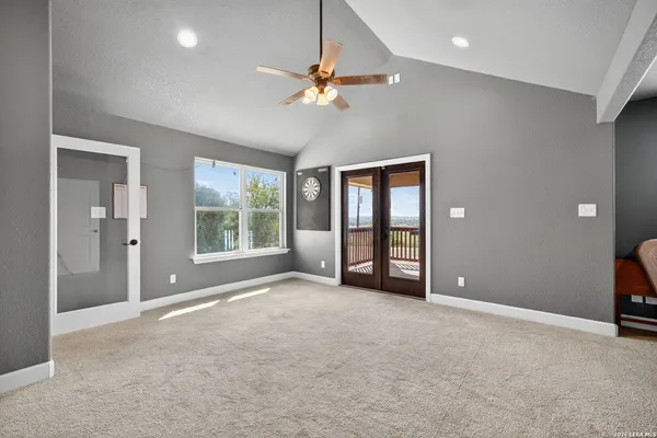 a bedroom with bed and a couch