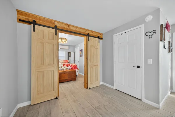a view of a balcony with wooden floor
