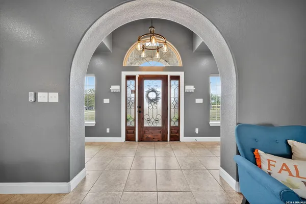 a view of an entryway with wooden floor
