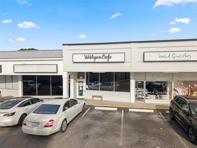 a roof deck with table and chairs with mountain view