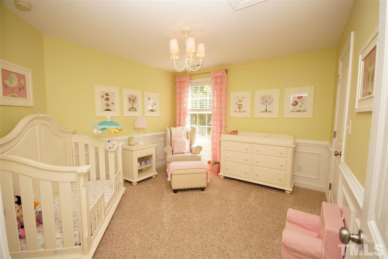 3015 Red Grape Drive Raleigh, NC 27607 - Photo 16 of 25 a living room with furniture and a chandelier