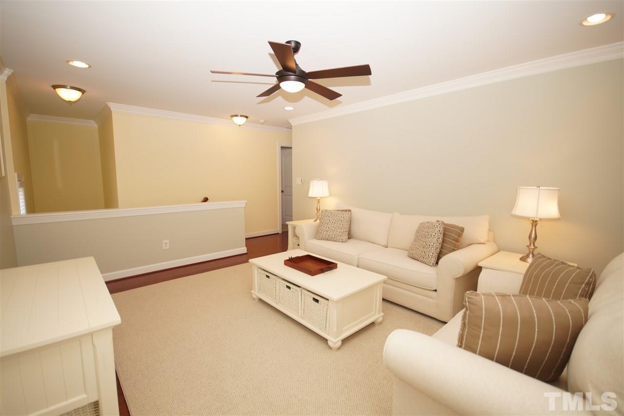 3015 Red Grape Drive Raleigh, NC 27607 - Photo 19 of 25 a living room with furniture and a table