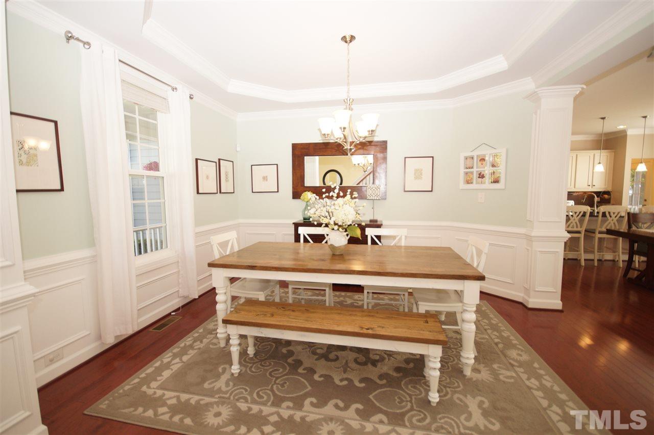 3015 Red Grape Drive Raleigh, NC 27607 - Photo 3 of 25 a view of a dining room with furniture window and wooden floor