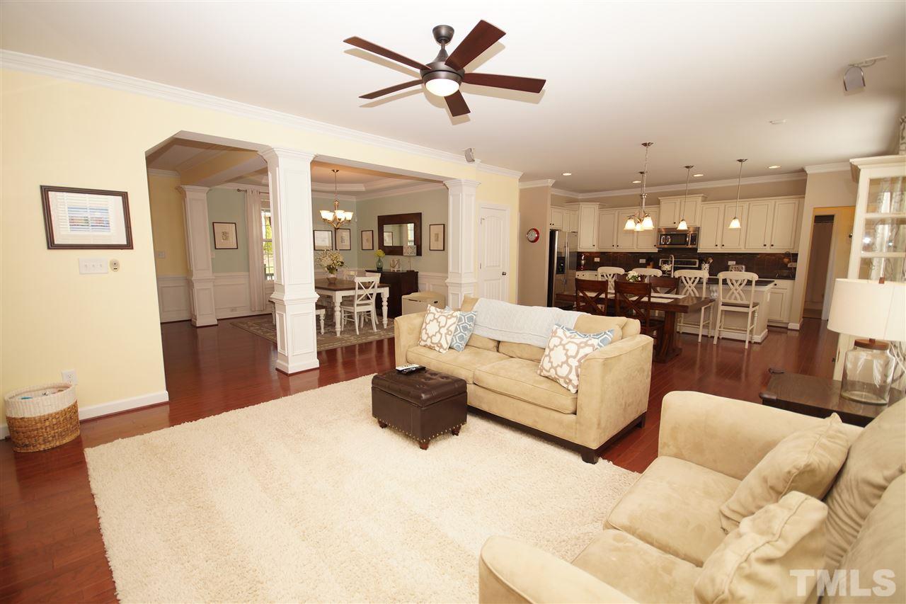 3015 Red Grape Drive Raleigh, NC 27607 - Photo 4 of 25 a living room with furniture and a wooden floor