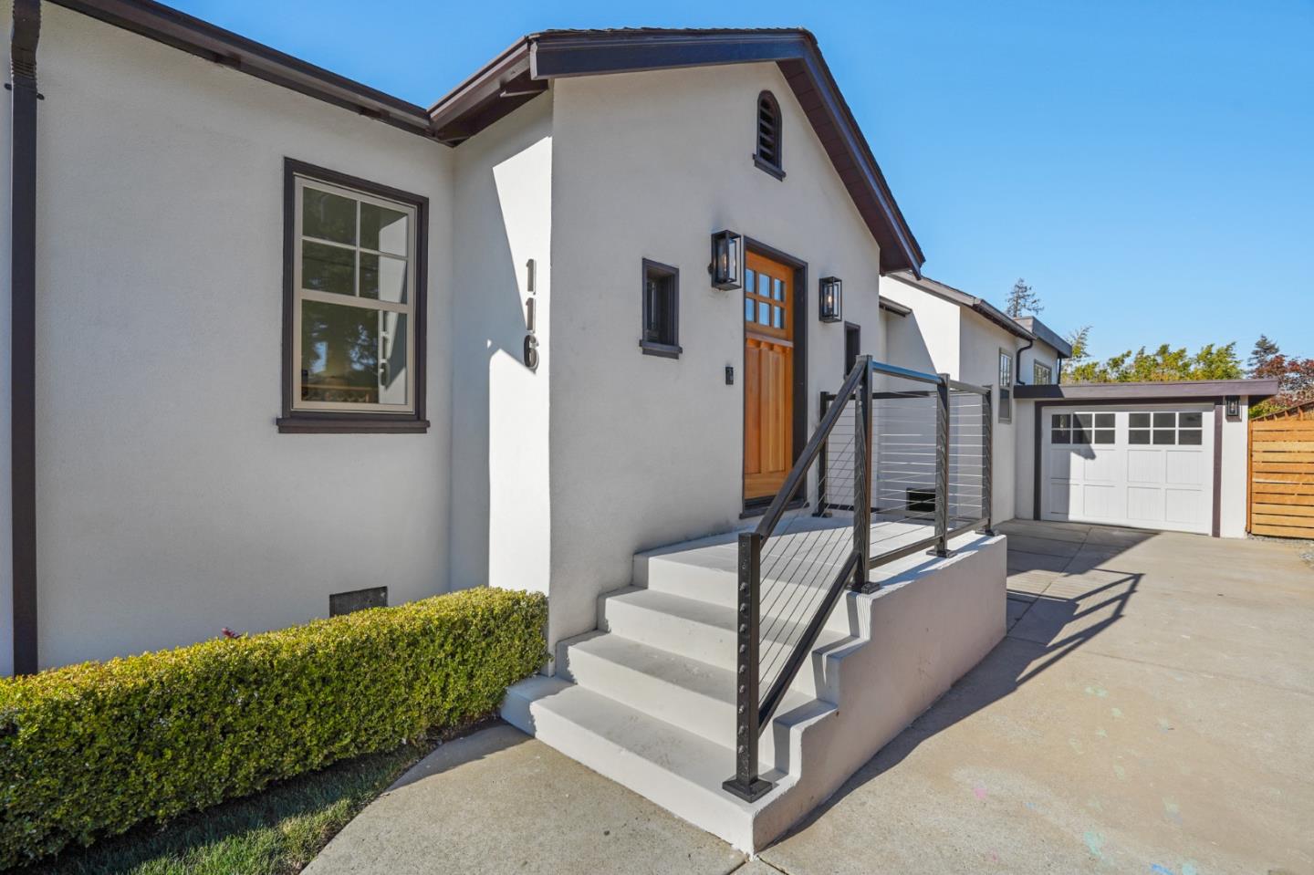 116 Channing Road Burlingame, CA 94010 - Photo 4 of 10 a view of a house with couches and wooden fence