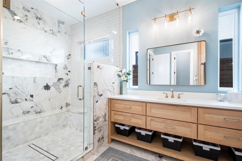 2093 Holt Way Grapevine, TX 76051 - Photo 17 of 40 a bathroom with a double vanity sink mirror and shower