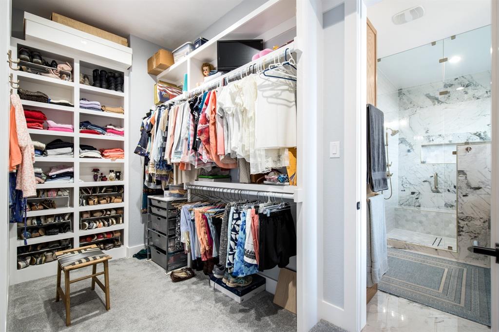 2093 Holt Way Grapevine, TX 76051 - Photo 20 of 40 a view of walk in closet with clothes and shoes